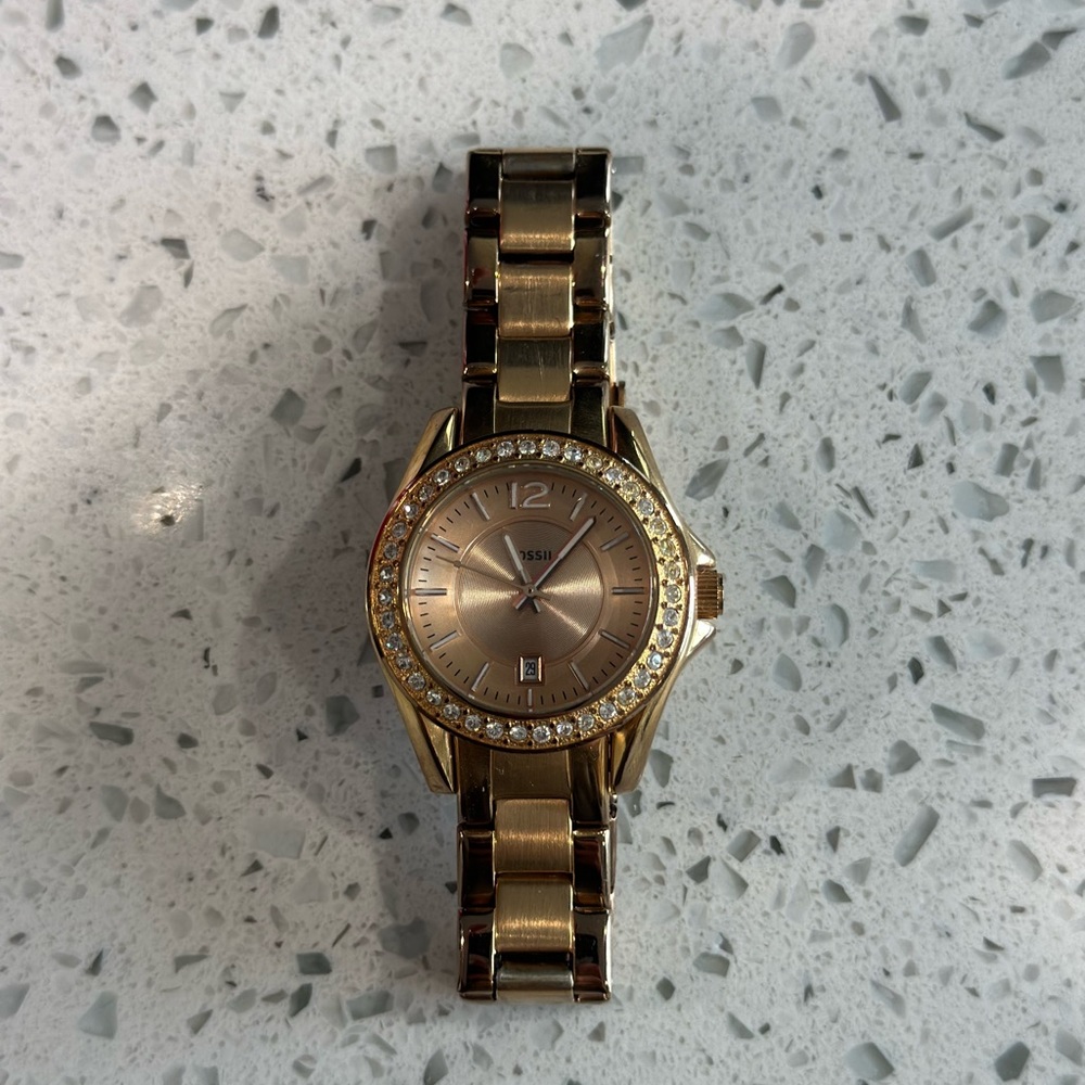 Women’s gold fossil watch